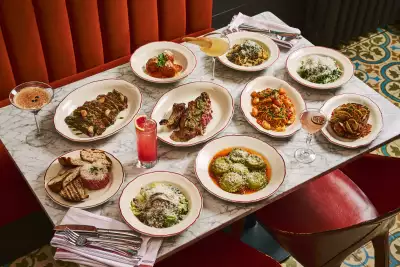 Best new Italian restaurants in Toronto | A table full of dishes at Proper in Roncesvalles