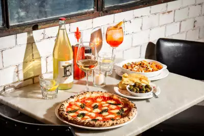 Best new Toronto restaurants | A spread of pizza and wine at Bar Libretto