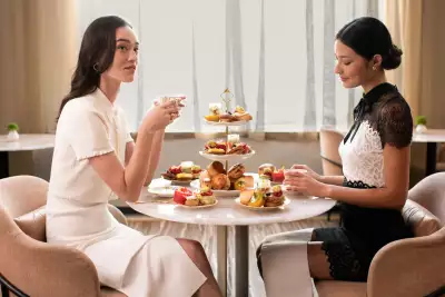 Mother's Day gifts | Two ladies sit across from each other and enjoy afternoon tea at dbar by Daniel Boulud at Four Seasons Yorkville