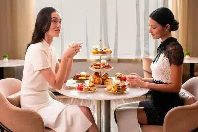 Mother's Day gifts | Two ladies sit across from each other and enjoy afternoon tea at dbar by Daniel Boulud at Four Seasons Yorkville
