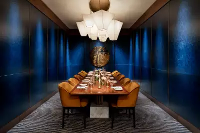 REIGN Toronto | A plush private dining space with a cobalt blue backdrop at REIGN