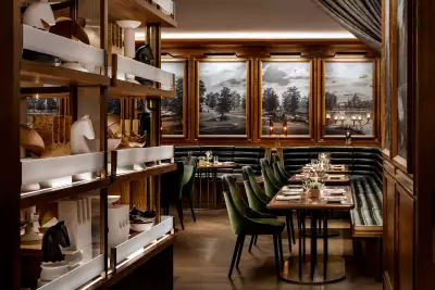 REIGN Toronto | The dining room at REIGN, with booths, a table and artwork decorating the interior