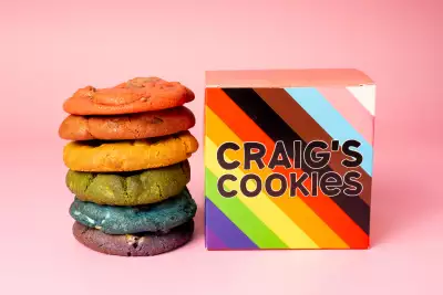 Queer-owned businesses in Toronto | A stack of Craigs Cookies Pride Month cookies next to a box