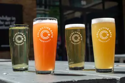 Best patios in Toronto | A lineup of Collective Arts beer on the patio at Waterworks Food Hall