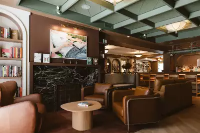 New Toronto restaurants | Comfy chairs and art on the wall at Book Bar Toronto