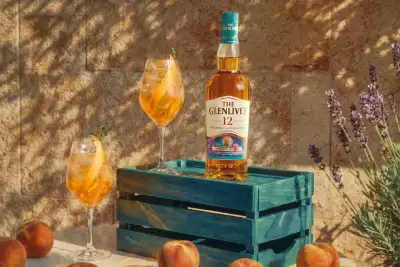 The Glenlivet 12 Year Old Beyond Speyside Series: Provence Edition on a crate with cocktails