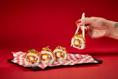 Chopsticks picking up Bento's new Nashville Hot Chicken Roll