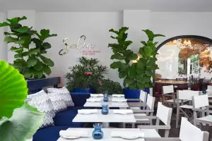 Restaurants with art | Blue velvet seating at Sofia