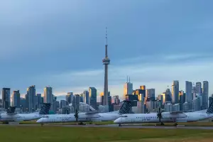 Airplanes at Billy Bishop Toronto City Airport in front of the Toronto skyline Airplanes at Billy Bishop Toronto City Airport in front of the Toronto skyline