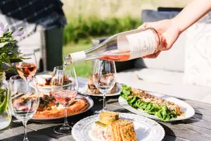 Pouring wine with dinner at the Benchlands Blanc Party in Jordan Village