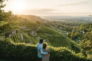 Saxony, Germany | A couple overlooks vineyards in Radebeul Saxony, Germany | A couple overlooks vineyards in Radebeul