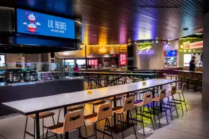Queen's Cross Food Hall | A view of one of the seating areas at Queen's Cross Food Hall, in front of Lil Rebel by Eric Chong