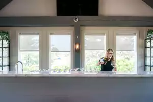 Ontario Wine Awards | Someone pouring wine at Domaine Queylus