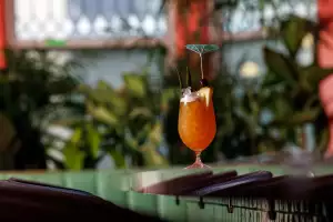 The best bars in Toronto | A tropical cocktail garnished with a pineapple at Le Tigre