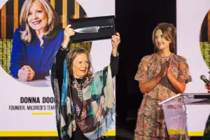 The 2024 foodism ICON Awards | Donna Dooher holds up her award at the foodism ICON Awards The 2024 foodism ICON Awards | Donna Dooher holds up her award at the foodism ICON Awards