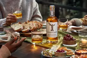 Glendalough Double Barrel Irish Whiskey bottle with glasses and food
