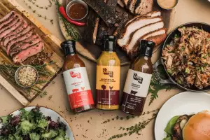Win a Shop The Carbon Bar gift card | A spread of meat, chicken, burgers and BBQ sauce from The Carbon Bar
