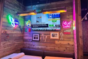 New restaurants in Toronto | Neon signs and a TV inside Blanco Cantina in Toronto