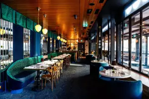 New restaurants in Toronto | A dining area with colourful banquette seating inside Piano Piano on Bloor