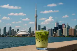 Matcha cafés, lattes and treats in Toronto | A matcha latte against the Toronto skyline