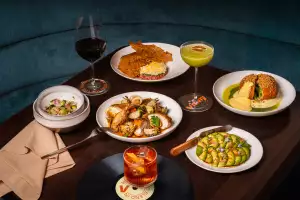 Best new Toronto restaurants | A spread of dishes inside Vinny Restaurant + Vinyl Bar