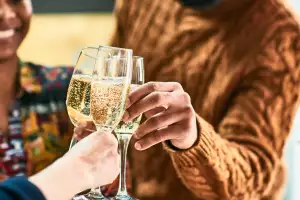 UK Guide to Food and Wine | A couple cheers with two glasses of sparkling wine