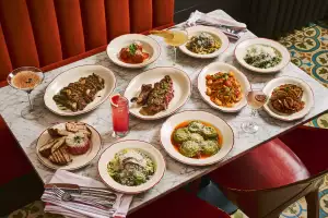 Best new Italian restaurants in Toronto | A table full of dishes at Proper in Roncesvalles