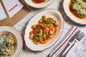 Best new Italian restaurants in Toronto | A spread of dishes at Proper in Roncesvalles