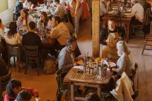Farm-to-table dining in Qu&eacute;bec: Marie Daudlin, co-owner of the agritourism farm Le Mangeoir, serves guests in the dining room