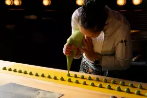 Pasta Privato Toronto | A chef pipes a green sauce into a filled fresh pasta at Pasta Privato in Toronto
