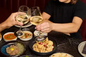 Toronto food news | A spread of lunch dishes and wine at Lyla
