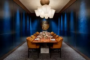 REIGN Toronto | A plush private dining space with a cobalt blue backdrop at REIGN