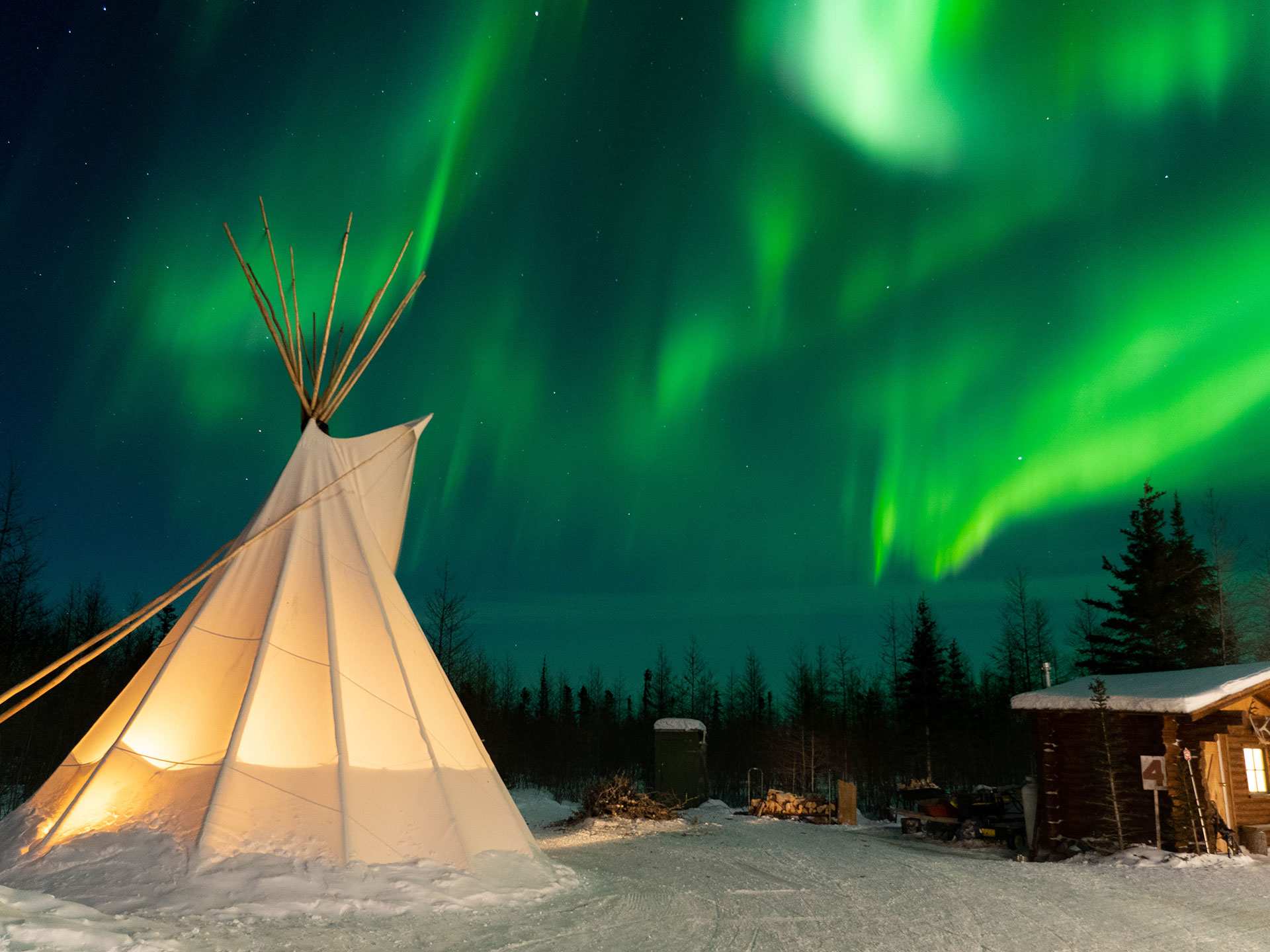 Visit Churchill Manitoba | The Northern Lights over Teepee Village