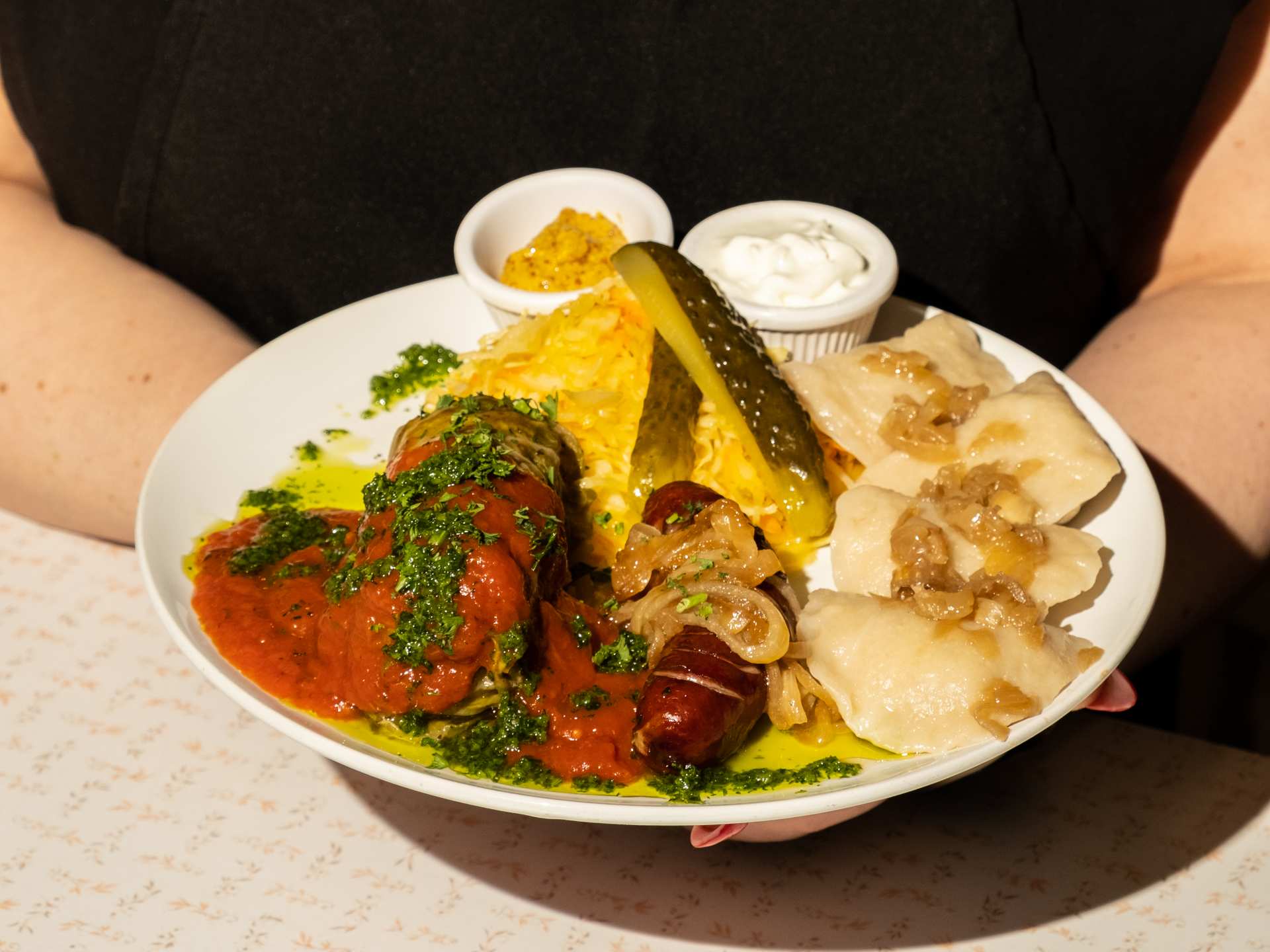 Cheap eats in Toronto | A plate of pierogies, sausage and other bites from Hastings Snack Bar Cheap eats in Toronto | A plate of pierogies, sausage and other bites from Hastings Snack Bar