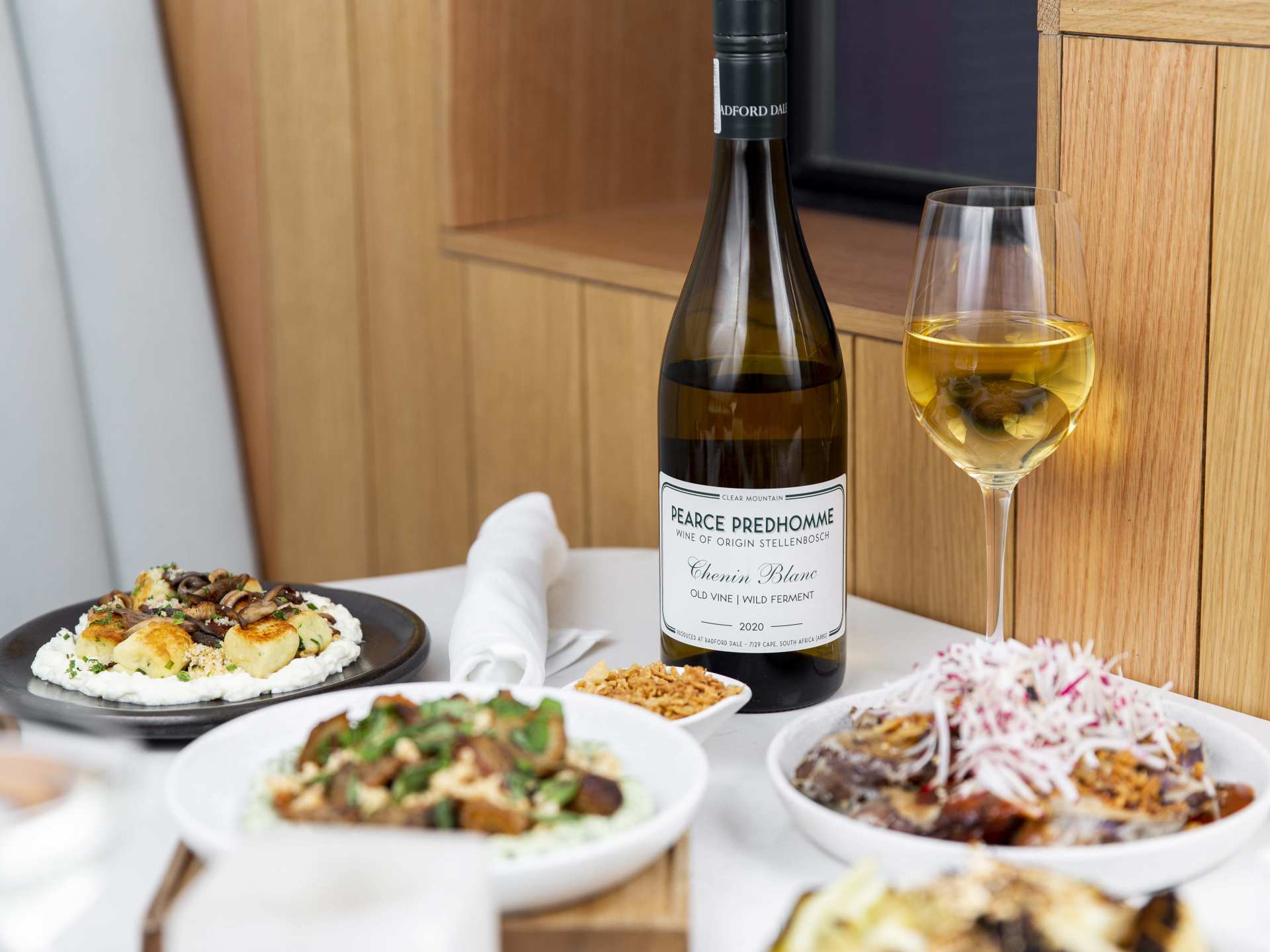 Best Michelin Guide restaurants | A glass and bottle of wine with food at Sara restaurant Best Michelin Guide restaurants | A glass and bottle of wine with food at Sara restaurant