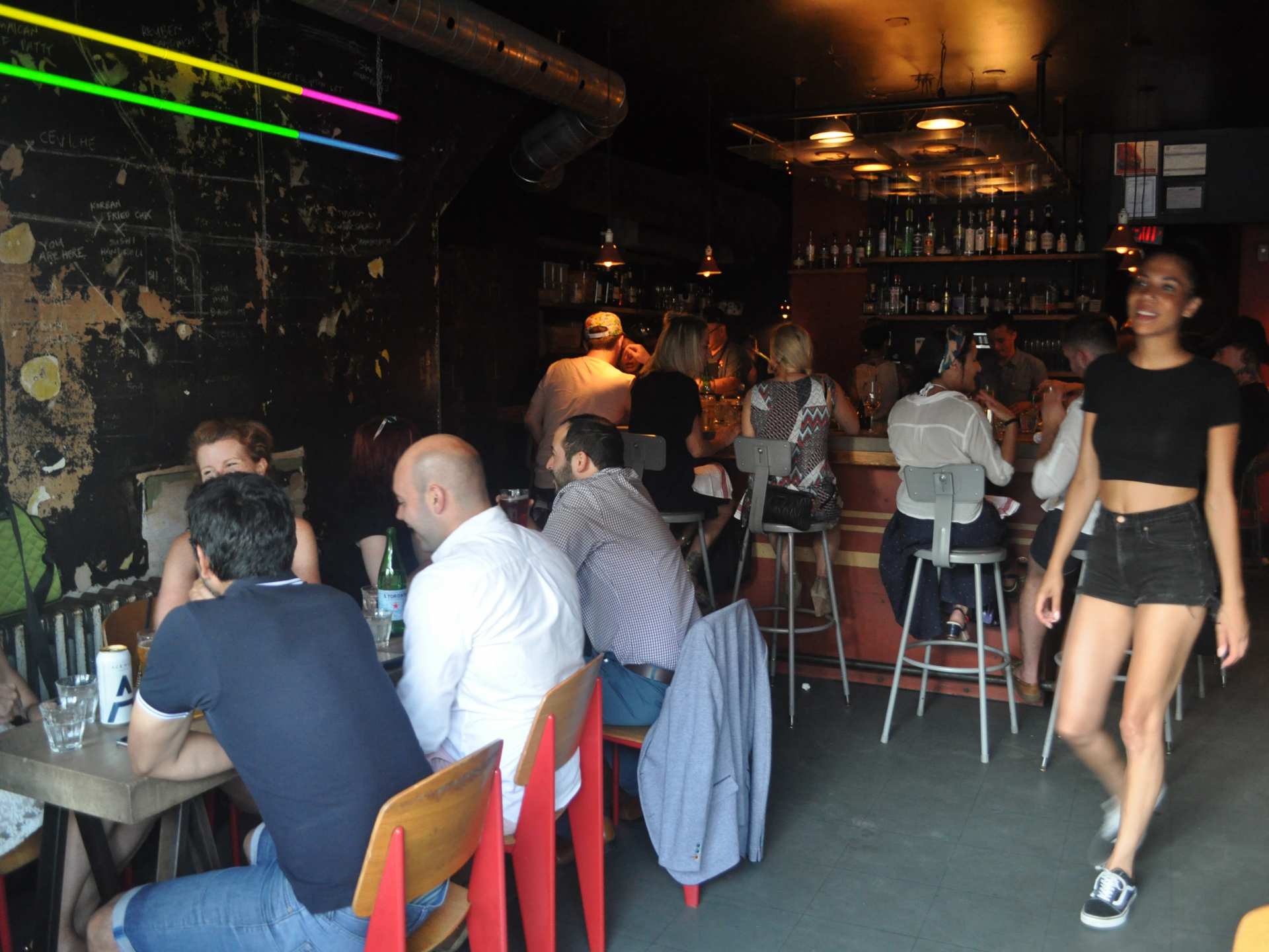 Late-night food in Toronto | Guests sitting at tables at 416 Snack Bar Late-night food in Toronto | Guests sitting at tables at 416 Snack Bar