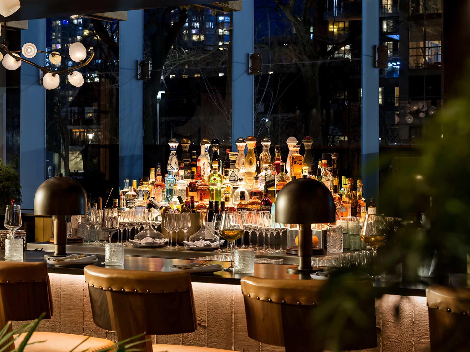 Happy Hour Toronto | The well-lit bar and alcohol bottles at Casa Madera