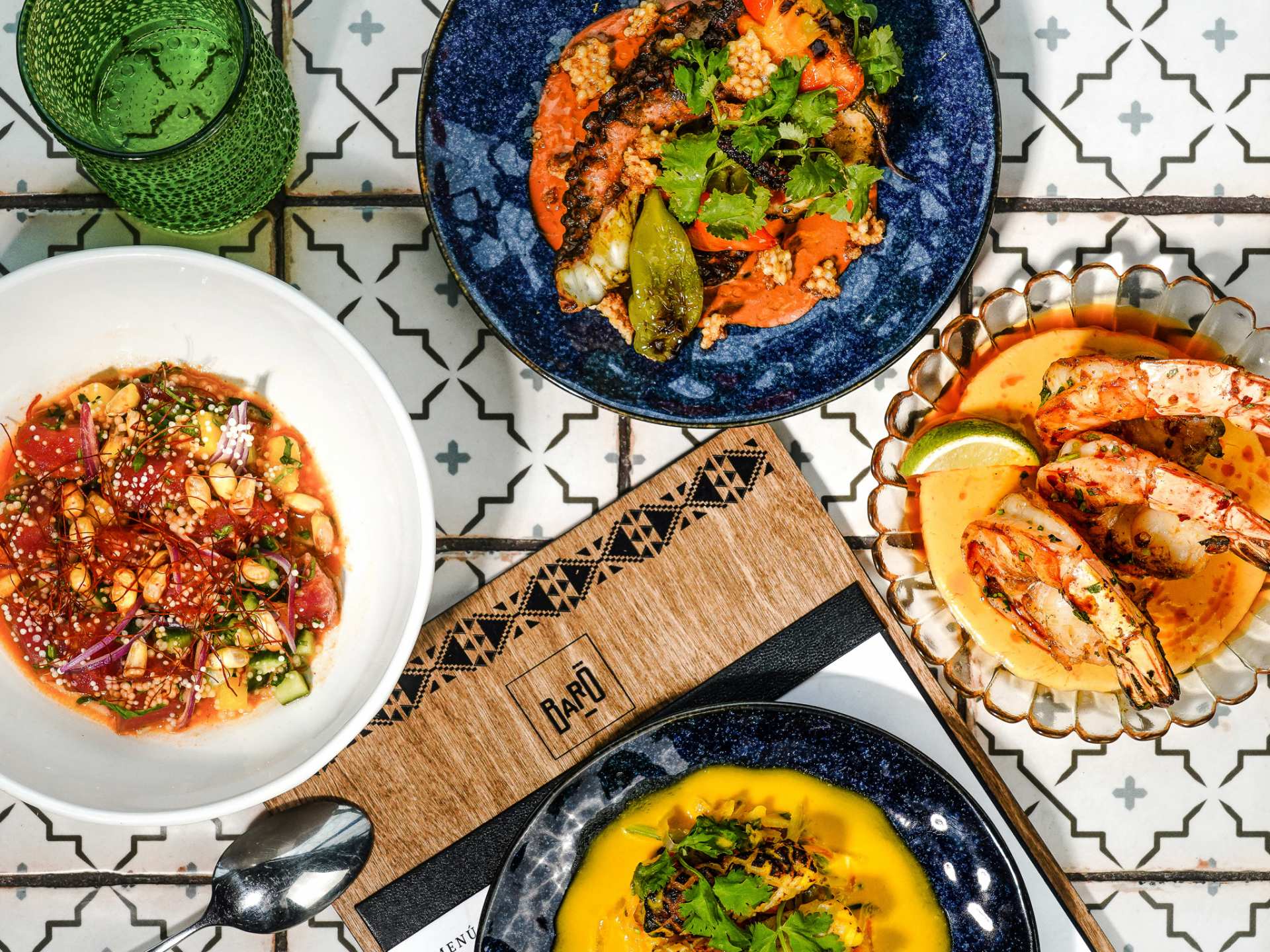 Best patios in Toronto | A spread of dishes at Baro