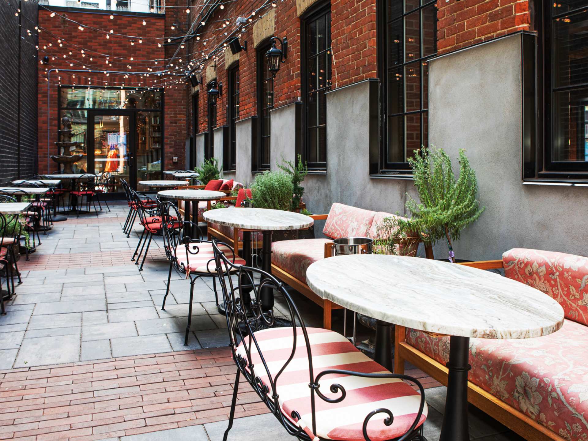Best patios in Toronto | Bistro tables and chairs on Lapinou's alleyway patio