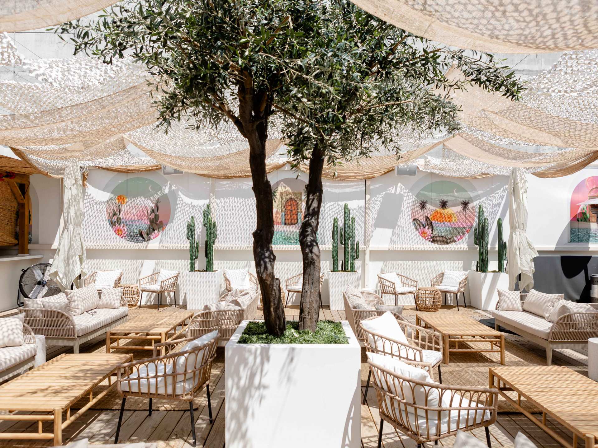 Best patios in Toronto | The rooftop patio at Soluna with a tree and couches