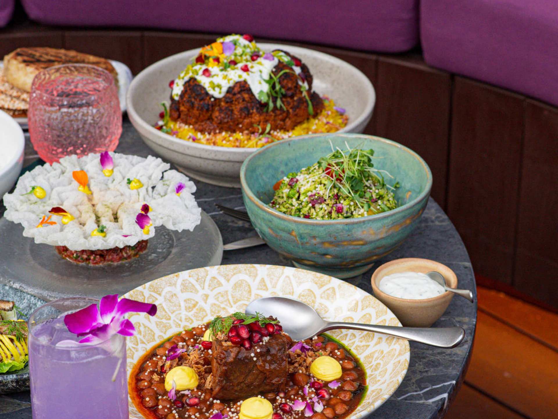 Best patios in Toronto | A spread of dishes on the patio at Skylight