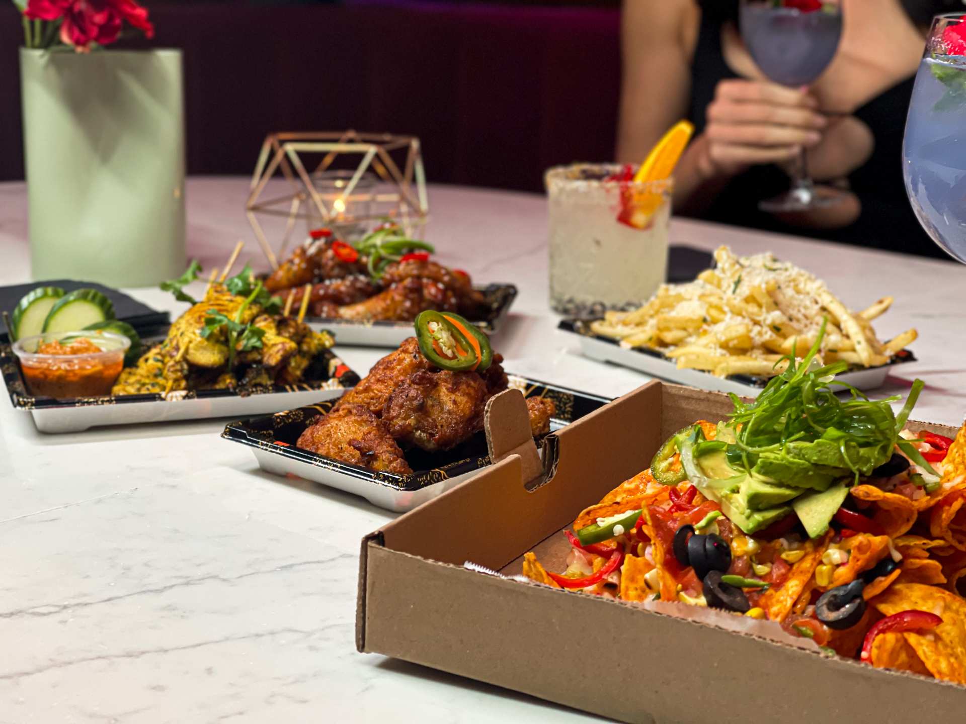 Best cocktail bars in Toronto | An assortment of food at Daisy