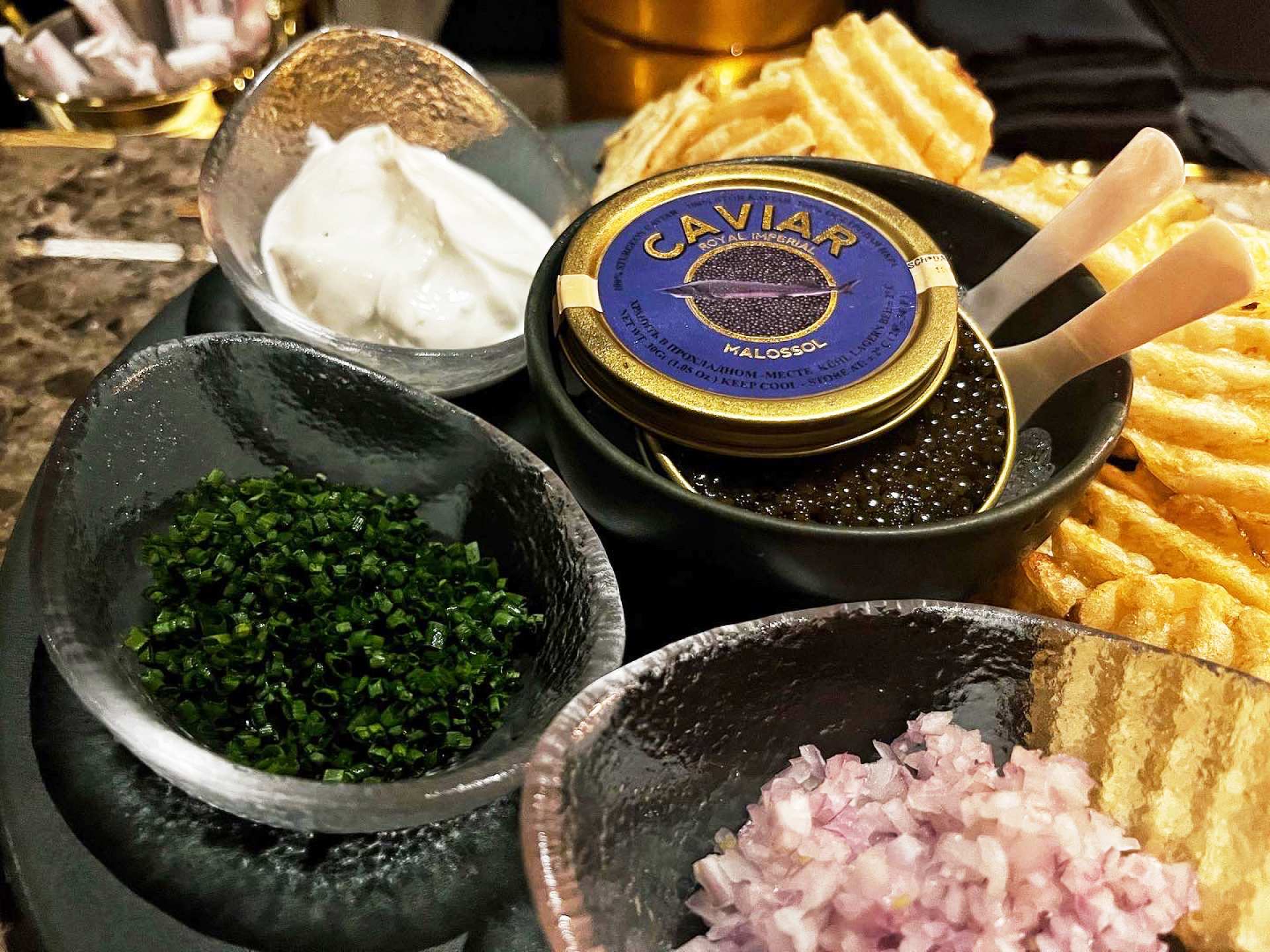Parc Ave's Kaluga Gold Caviar served with potato chips Parc Ave's Kaluga Gold Caviar served with potato chips