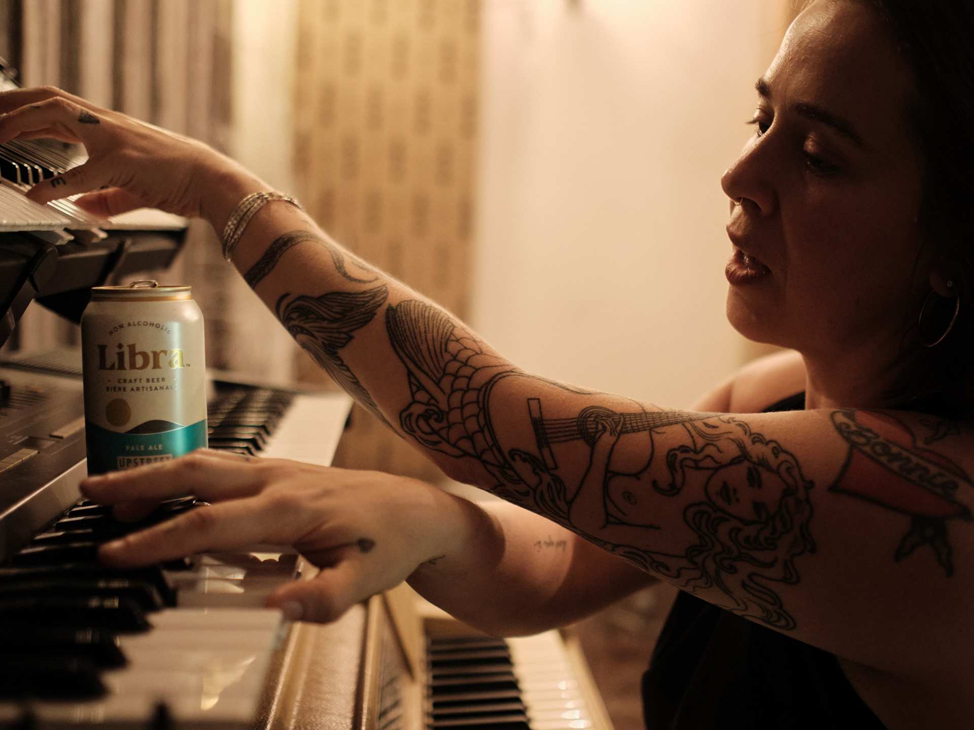 Serena Ryder at her piano with a can of Libra non-alcoholic beer Serena Ryder at her piano with a can of Libra non-alcoholic beer