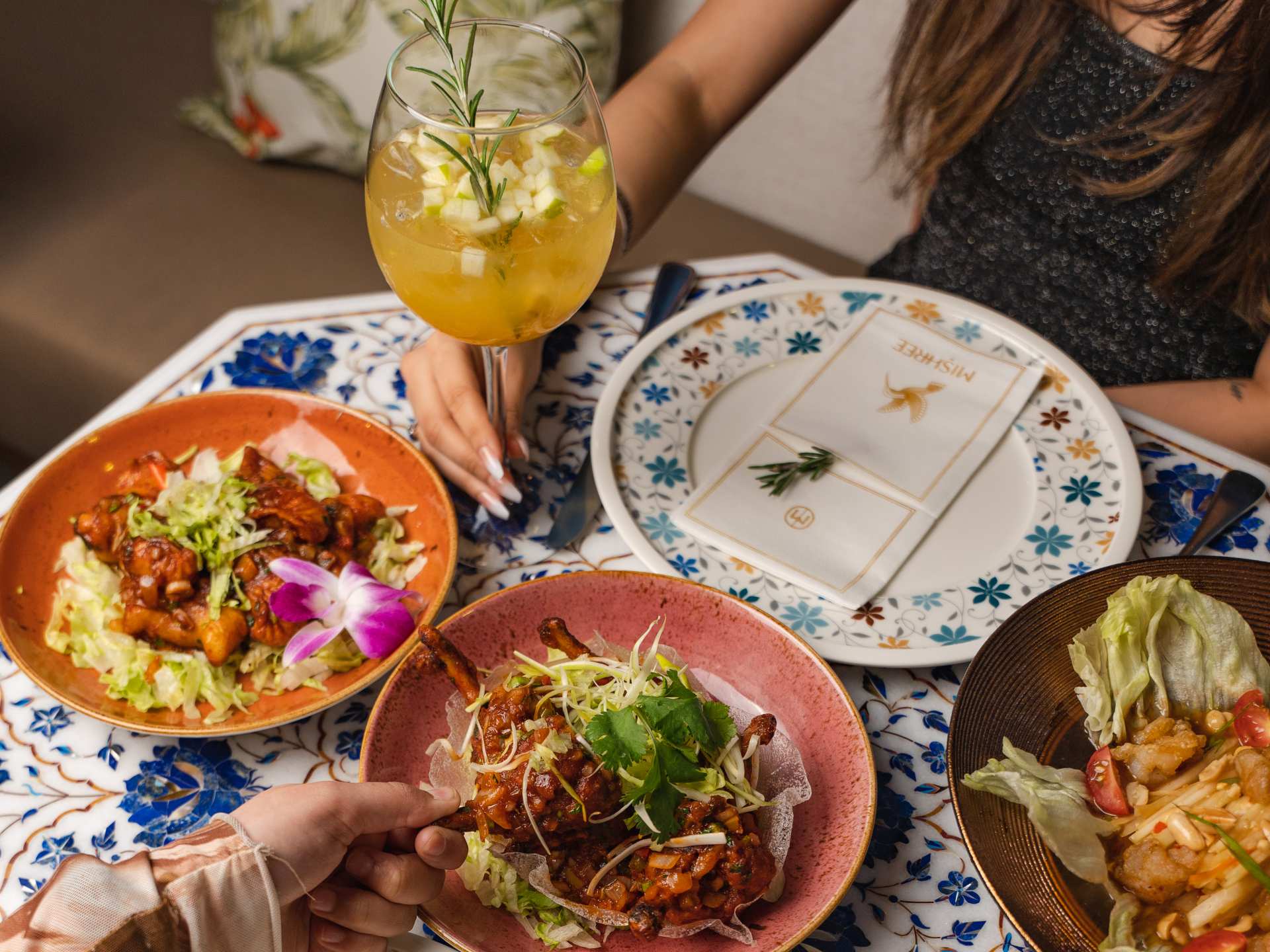 Best new Toronto restaurants | A spread of dishes and cocktails at Mishree