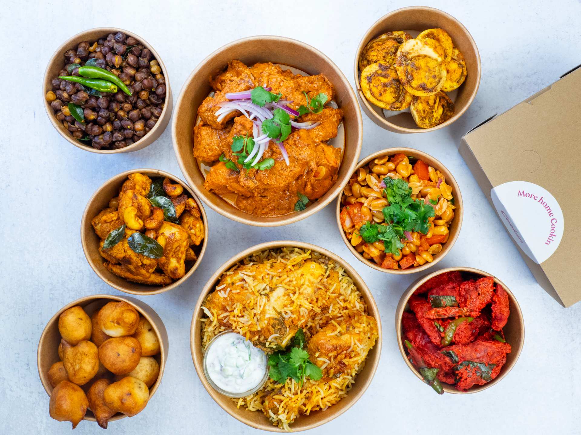 Cookin app for homemade food delivery | A spread of dishes in takeout containers from Tastes of Telanga Cookin app for homemade food delivery | A spread of dishes in takeout containers from Tastes of Telanga