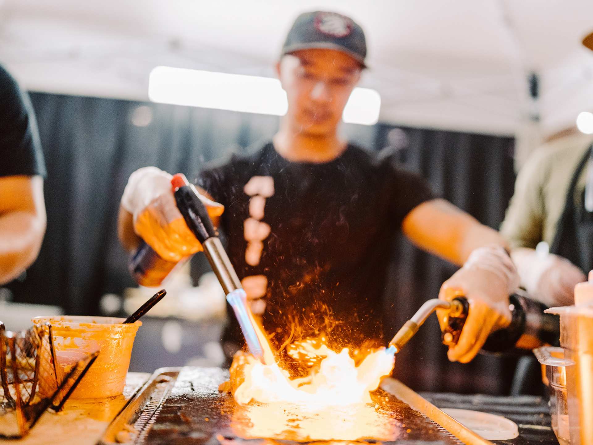 A chef with a blowtorch at T.O. Food and Drink Fest A chef with a blowtorch at T.O. Food and Drink Fest