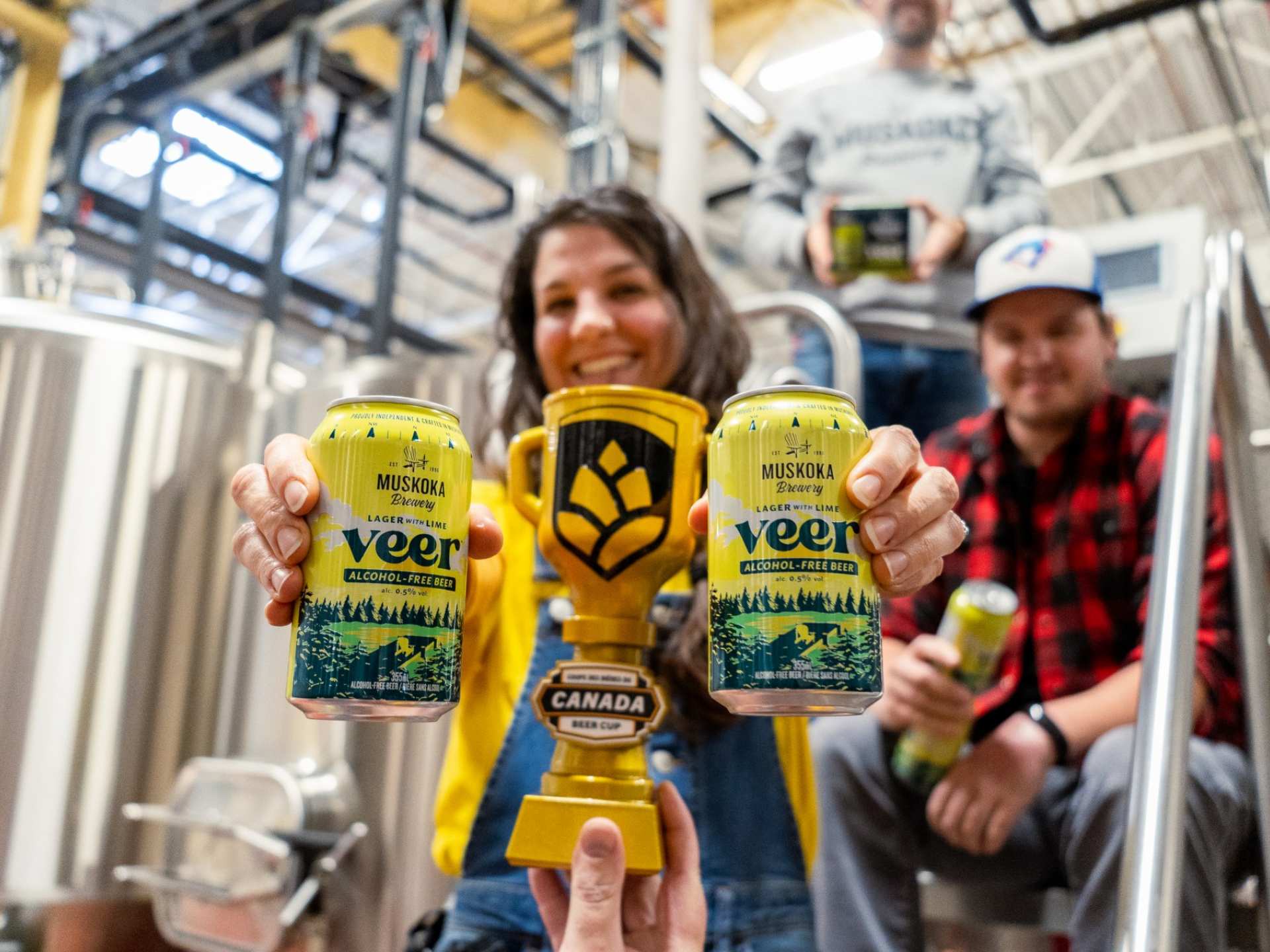 Brewers holding Veer non-alcoholic beer at Muskoka Brewery Brewers holding Veer non-alcoholic beer at Muskoka Brewery
