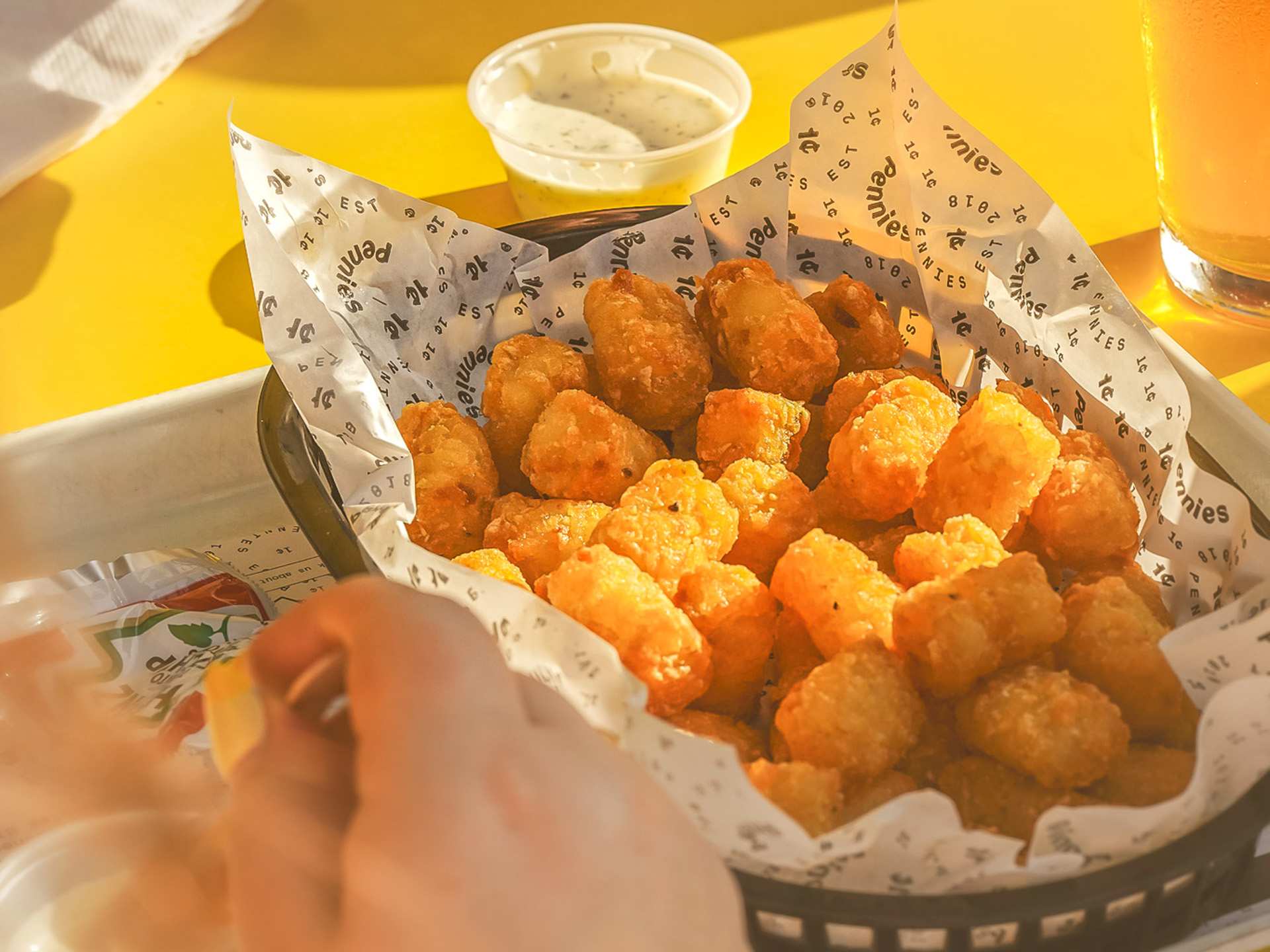 The best patios in Toronto | Tater tots on the patio at Pennies in Liberty Village