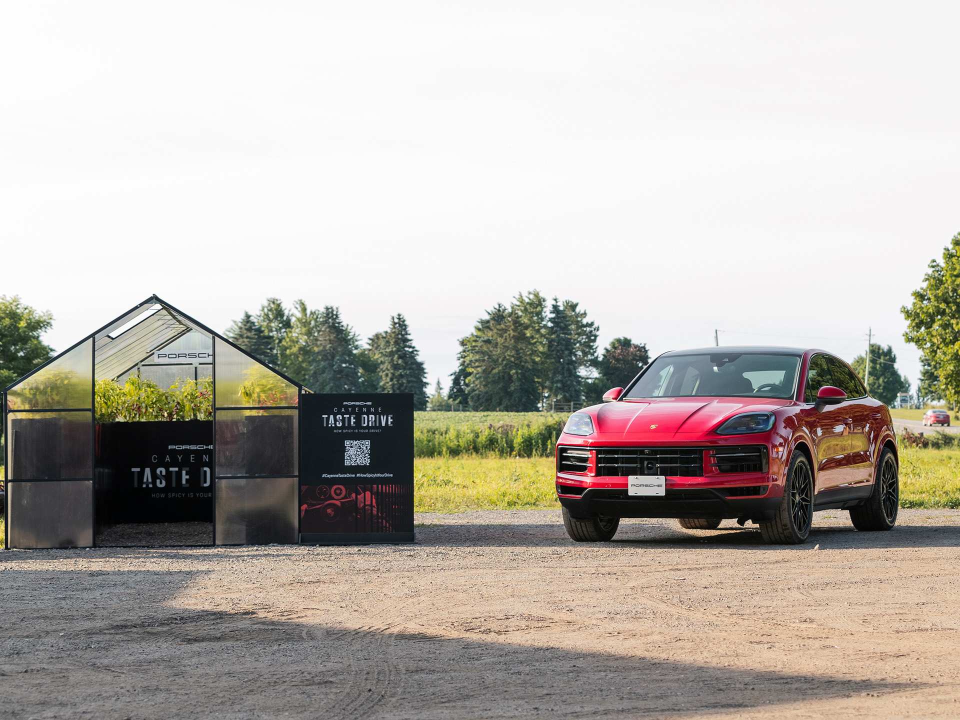 A red Porsche Cayenne beside the Taste Drive greenhouse A red Porsche Cayenne beside the Taste Drive greenhouse